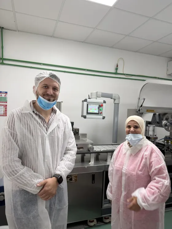 Co-founder in full protective equipment on the capsule production line