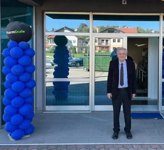 A senior advisor at the PharmScale facility entrance on opening day