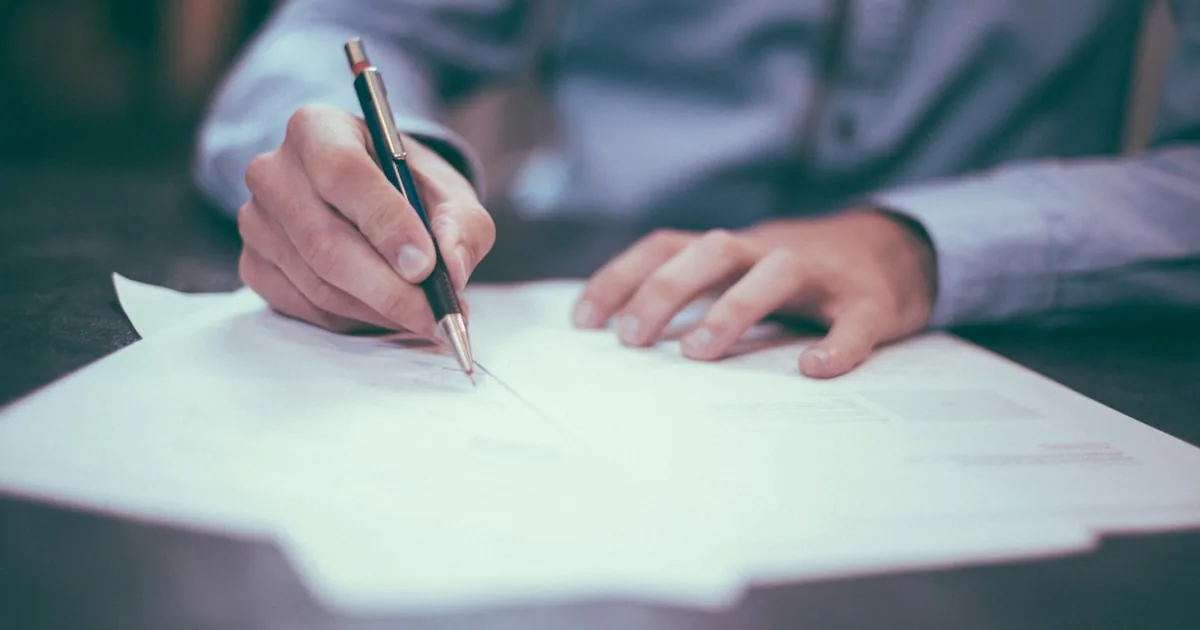 Hand reviewing and signing an analytical document
